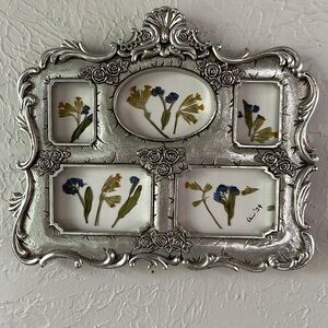 Handcrafted dried press, floral wall art. In unique ornate silver frame.